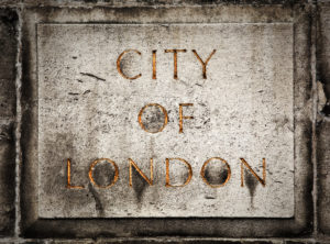 Old grunge stone board with golden City of London text